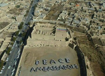 Tour guides formed a human chain to spell out the words "Peace Ambassadors".