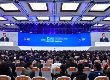 Delegates listen as Alibaba Group Executive Chairman Jack Ma speak during the opening ceremony of the 4th World Internet Conference  in Wuzhen in eastern China on December 3.