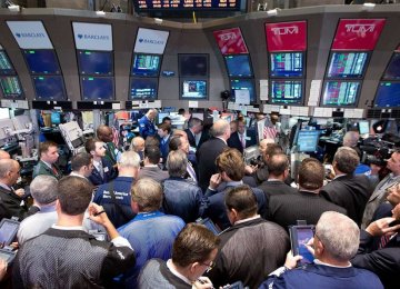 Traders work on the floor of the New York Stock Exchange.