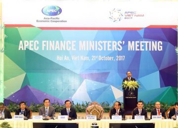 Vietnamese Prime Minister Nguyen Xuan Phuc (rear) speaks at the 24th APEC Finance Ministers’ Meeting in Hoi An, Quang Nam Province, in central Vietnam, on Oct. 21.