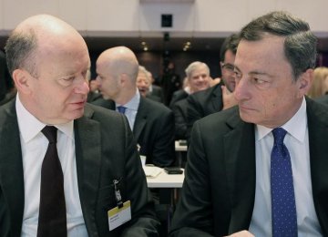 Deutsche Bank CEO John Cryan (L) and ECB President Mario Draghi at a conference in Frankfurt on Sept. 6.