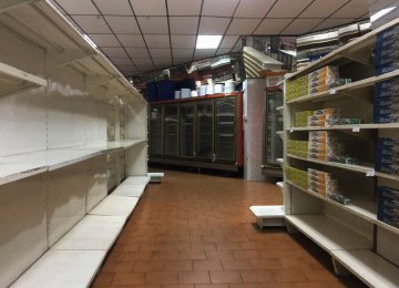 Empty supermarket shelves in Caracas. The government has forced more that 200 establishments  to lower prices in the middle of a hyperinflationary spiral.