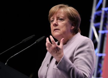Merkel Rebuffs Critics of Trade Surplus