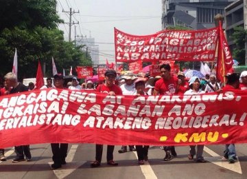 Members of Kilusang Mayo Uno march on Labor Day, May 1.