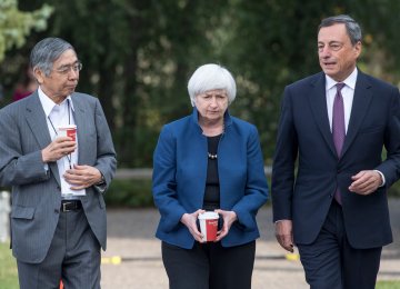 Bank of Japan Gov. Haruhiko Kuroda (L), Federal Reserve chief Janet Yellen (C) and ECB’s Mario Draghi, walk the grounds at the Jackson Hole economic symposium in Moran, Wyoming in July.