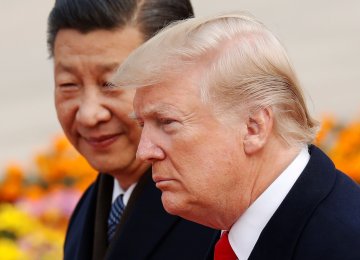 US President Donald Trump (Front) and his Chinese counterpart Xi Jinping