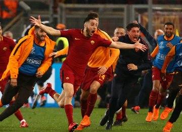 Roma players celebrate the team’s third goal scored by Greek defender Kostas Manolas.