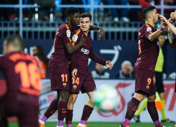 Barca squad celebrate their win.