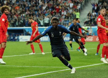 France’s Samuel Umtiti celebrates opening the scoring.