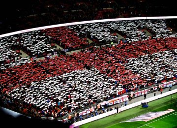 England fans shaping the flag with mosaics.