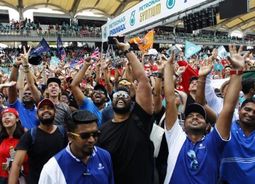 Fans react as they watch the podium finish in Malaysia Grand Prix 2017 in Sepang, October 1.