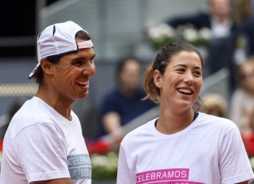 Rafael Nadal (L) and Garbine Muguruza