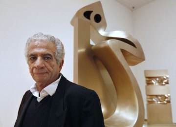 Parviz Tanavoli and one of his sculptures