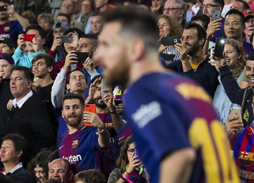 Reza Parastesh takes a photo of Messi during the match between Barcelona and Malaga at Nou Camp on Oct. 21.