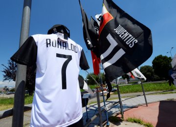 A Juventus’ jersey with the name of Cristiano Ronaldo  is exhibited in a shop in Turin.