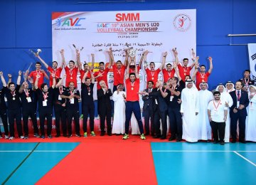 The team celebrates winning the title.