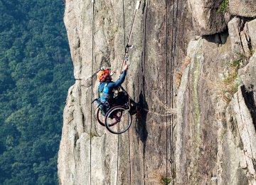 Lai Chi-wai climbs the Lion  Rock in Hong Kong.