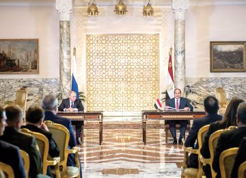 Egyptian President Abdel Fattah al-Sisi and his Russian counterpart Vladimir Putin (L) give a press conference following their talks at the presidential palace in Cairo on Dec. 11.