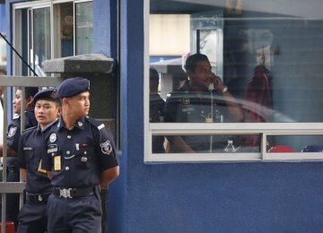 Police officers guard the main gate of the forensic department at Kuala Lumpur Hospital in Kuala Lumpur, Malaysia, on Feb. 22.