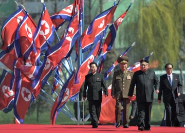 Kim Jong-un (2nd R) on April 13