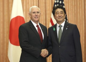 Shinzo Abe (R) and Mike Pence meet in Tokyo, Japan, on April 18.