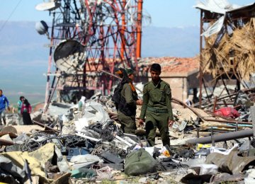 YPG forces at the site of Turkish airstrikes near the northeastern Syrian Kurdish town of Derik. 