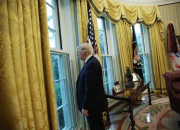 Donald Trump attends the Oval Office in the White House, Washington, on April 27.