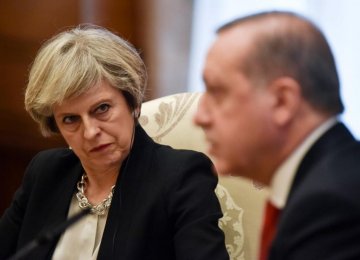 British Premier Theresa May (L) and Turkish President Recep Tayyip Erdogan meet in Ankara, Turkey, on Jan. 28.