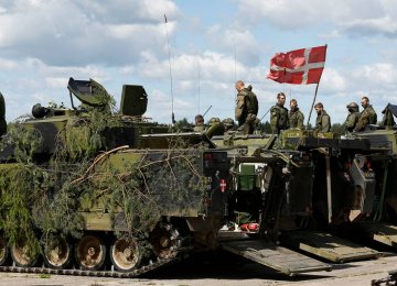 Danish soldiers participate in  a military exercise.