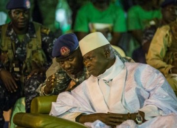 Gambian President Yahya Jammeh listens to one of his aides in Banjul in Nov. 2016. (File Photo)