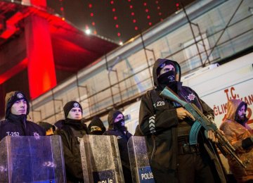 Turkish police secure the area at Ortakoy District under Bosphorus Bridge in Istanbul on Jan. 1.