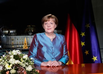 Merkel Defends Refugee Plan in New Year Message