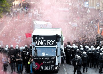 Riot police block the “Welcome to Hell” rally against the G20 summit in Hamburg, northern Germany on July 7.