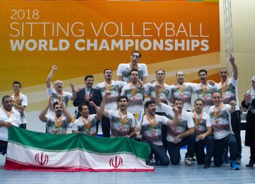 The national volleyball team celebrates the victory.