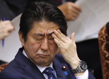 Embattled Abe May Quit in June