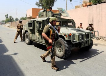 Afghan security forces arrive at the site of gunfire and attack in Jalalabad, Afghanistan, on July 11.