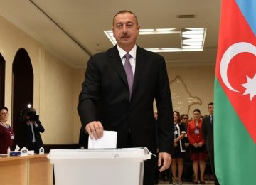 Ilham Aliyev casts his vote during a referendum on extending presidential terms in Baku in September 2016.