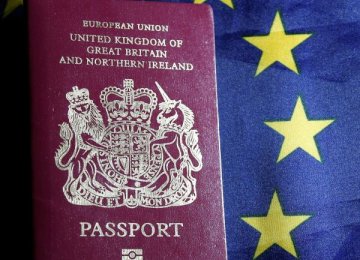 A British passport is pictured in front of an European Union flag in this photo illustration.