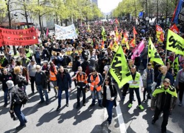 Public railways SNCF workers demonstrate against planned reforms of the French government on April 13 in Paris.