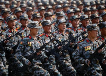 North Korean soldiers march during a military parade marking the 105th birth anniversary of the country’s founding father Kim Il-sung in Pyongyang on April 15, 2017.