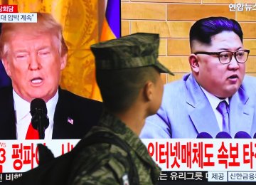 US President Donald Trump (L) and North Korean leader Kim Jong-un
