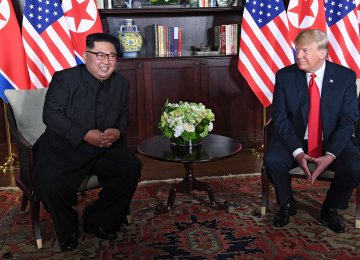 US President Donald Trump (R) and North Korean leader Kim Jong-un in Singapore on June 12