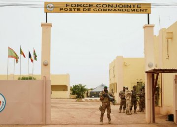 A Malian army soldier with the G5 Sahel stands at the entrance of a G5 Sahel command post in Sevare on May 30. (File Photo)