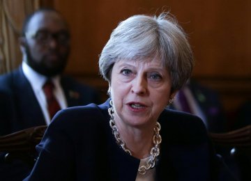 May Apologizes to Caribbean States on UK Treatment of Post-War Migrants