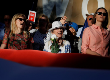 People gather during an anti-government protest in support of free courts  in front of the Senate building in Warsaw, Poland, on July 24.