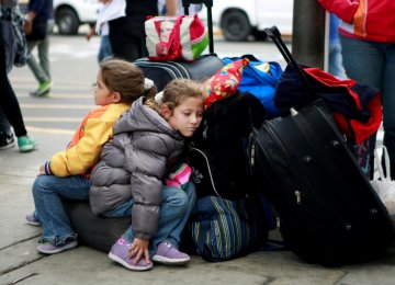 Venezuelan migrants wait to pass the Binational Border Service Center of Peru at the border with Ecuador,  in Tumbes, Peru, on August 24.