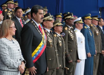 Venezuela’s President Nicolas Maduro and his wife Cilia Flores attend a military event in Caracas on August 4.