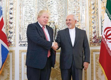 British Foreign Secretary Boris Johnson (L) meets Foreign Minister Mohammad Javad Zarif in Tehran on Dec. 9.