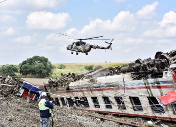 A helicopter flies over the site where a train derailed at Corlu district in Tekirdag, northwest Turkey, on July 9. (Photo: AFP)