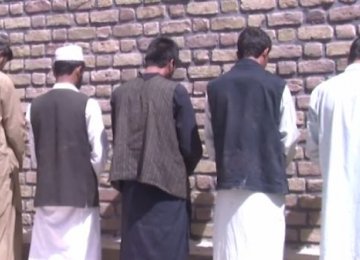 Afghan Forces Arrest 13 on Charges of Smuggling Dollars to Iran